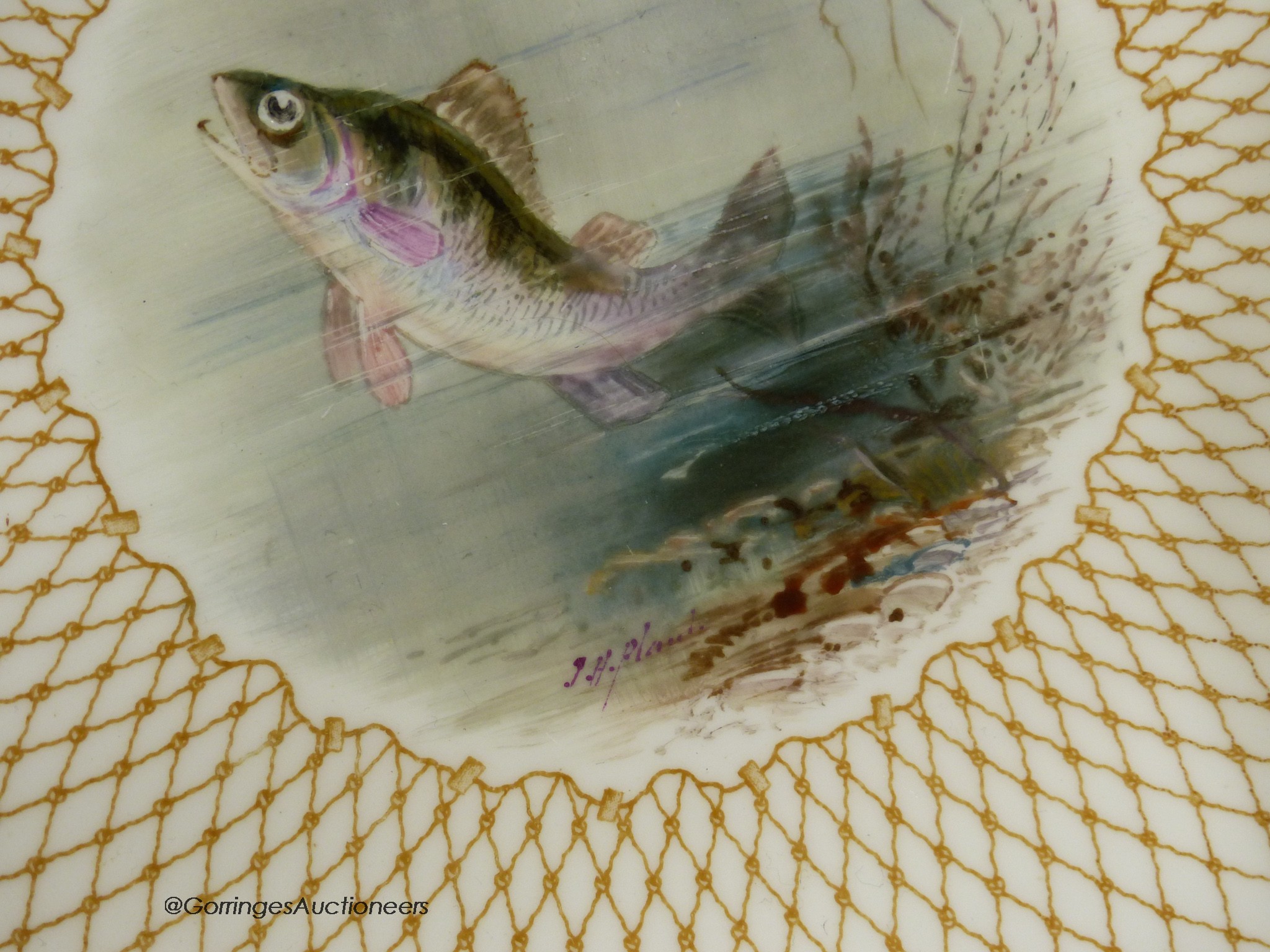 A Wedgwood pair of plates painted with named fish by J.H.Plant, signed